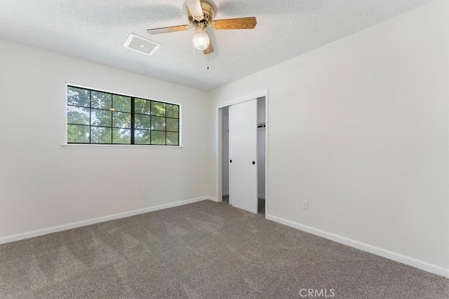 21999 Riverside Ave, Red Bluff, CA 96080 - spare room with carpet, a textured ceiling, and ceiling fan