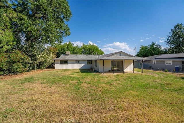 21999 Riverside Ave, Red Bluff, CA 96080 - rear view of house with a patio and a chimney