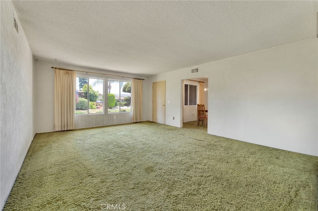 353 E Woodcroft Ave, Glendora, CA 91740 - empty room with a textured ceiling and carpet floors