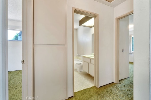 353 E Woodcroft Ave, Glendora, CA 91740 - corridor featuring light colored carpet