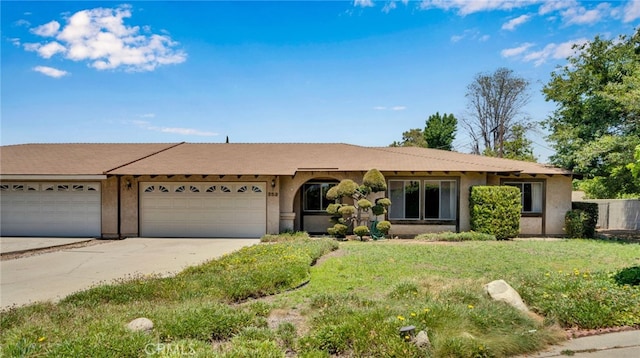 353 E Woodcroft Ave, Glendora, CA 91740 - ranch-style home featuring driveway, a garage, stucco siding, and a front lawn