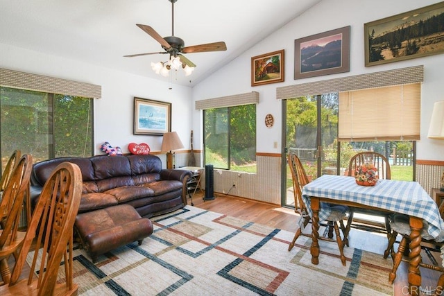 3096 Coral Tree Ln, Fallbrook, CA 92028 - living area featuring wood finished floors, a wainscoted wall, a ceiling fan, and high vaulted ceiling