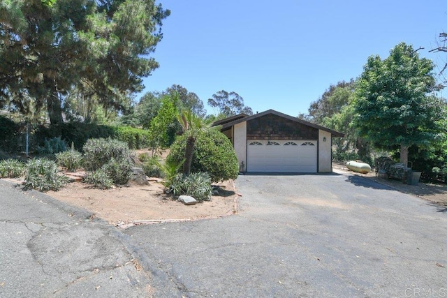 3096 Coral Tree Ln, Fallbrook, CA 92028 - view of front of house with asphalt driveway and a garage