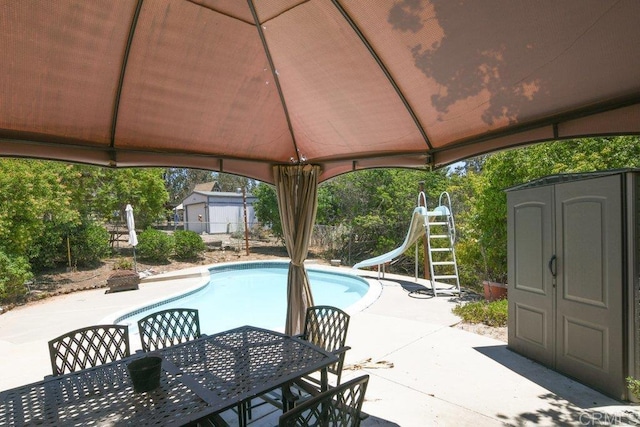 3096 Coral Tree Ln, Fallbrook, CA 92028 - outdoor pool featuring a water slide, a shed, a patio, and a gazebo