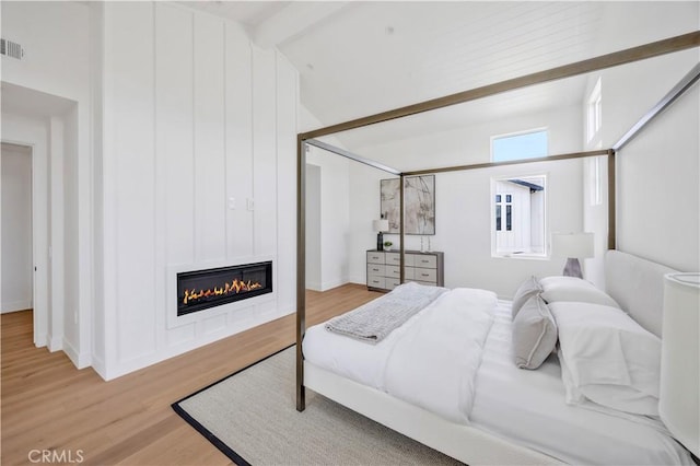 2102 Marshallfield Ln Unit A, Redondo Beach, CA 90278 - bedroom with wood finished floors and a large fireplace