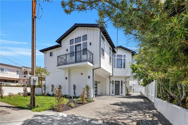 2102 Marshallfield Ln Unit A, Redondo Beach, CA 90278 - modern farmhouse featuring a balcony, board and batten siding, and concrete driveway