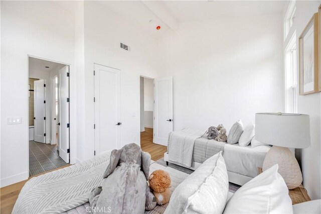 2102 Marshallfield Ln Unit A, Redondo Beach, CA 90278 - bedroom with beam ceiling, wood finished floors, and high vaulted ceiling