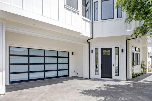 2102 Marshallfield Ln Unit A, Redondo Beach, CA 90278 - property entrance with board and batten siding, a garage, and driveway