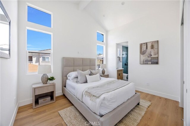 2102 Marshallfield Ln Unit A, Redondo Beach, CA 90278 - bedroom with high vaulted ceiling, beamed ceiling, light wood-type flooring, and ensuite bath