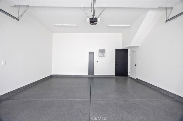 2102 Marshallfield Ln Unit A, Redondo Beach, CA 90278 - garage with a garage door opener and baseboards