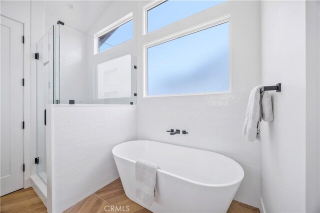 2102 Marshallfield Ln Unit A, Redondo Beach, CA 90278 - bathroom with a stall shower, a soaking tub, and wood finished floors