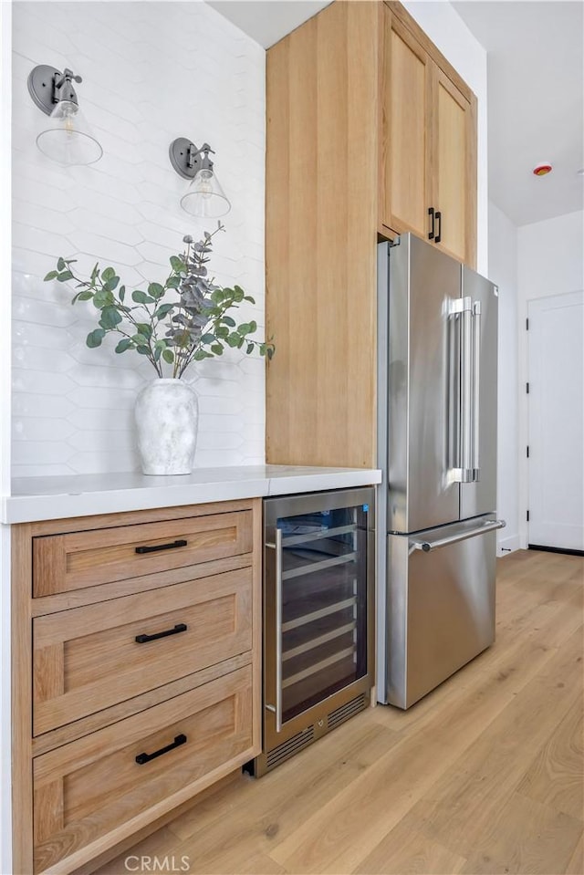 2102 Marshallfield Ln Unit A, Redondo Beach, CA 90278 - kitchen featuring high end refrigerator, wine cooler, light wood finished floors, light countertops, and light brown cabinetry