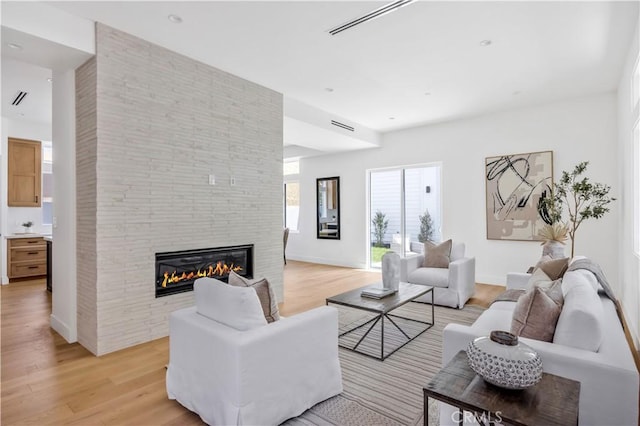 2102 Marshallfield Ln Unit A, Redondo Beach, CA 90278 - living area with a fireplace and light wood-style flooring