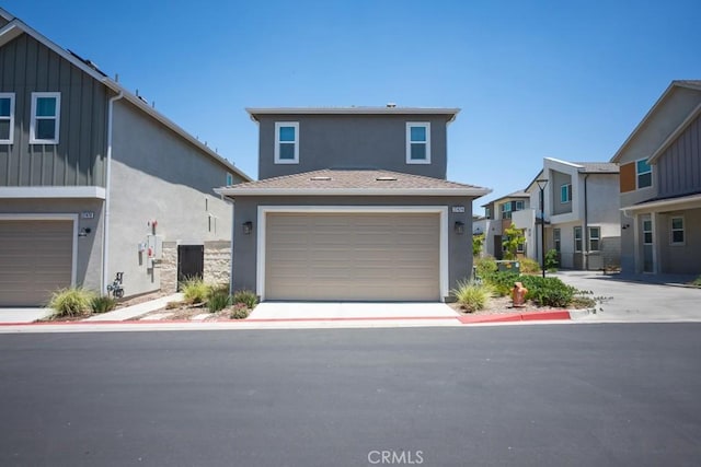 27474 Quiet View Pl, Valencia, CA 91381 - view of front of house featuring stucco siding, a garage, and board and batten siding