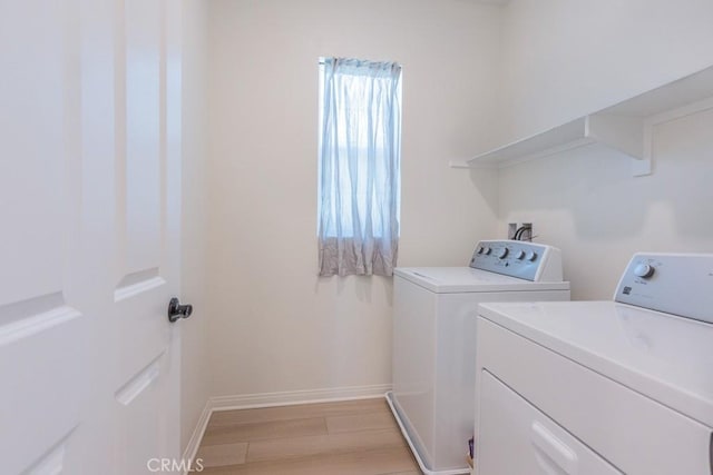 27474 Quiet View Pl, Valencia, CA 91381 - laundry room with separate washer and dryer and light wood finished floors