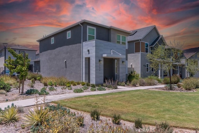 27474 Quiet View Pl, Valencia, CA 91381 - view of front of home with stucco siding and a yard