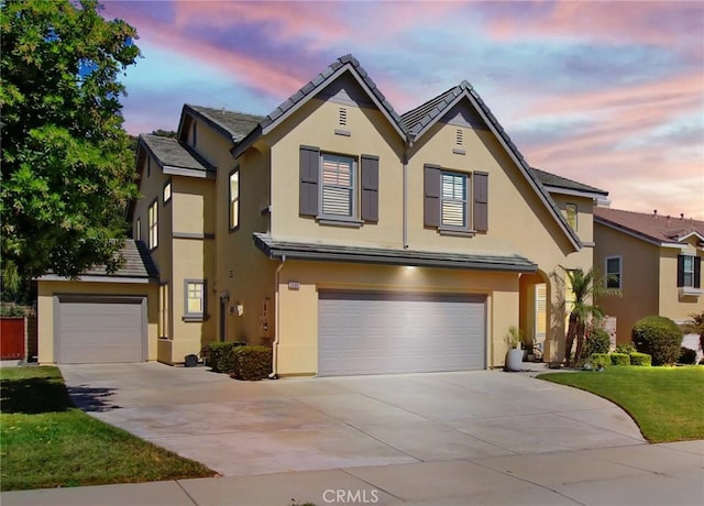 3090 Mangular Ave, Corona, CA 92882 - traditional home featuring stucco siding, an attached garage, concrete driveway, and a front lawn