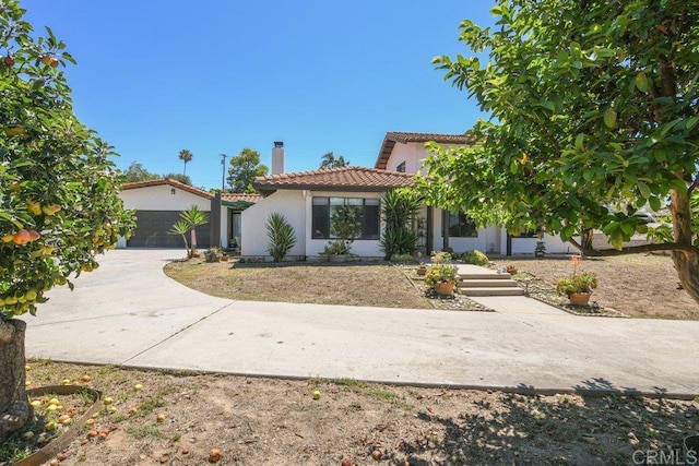 1736 Bellington Ln, Fallbrook, CA 92028 - mediterranean / spanish-style house with a tiled roof, stucco siding, a chimney, and a garage