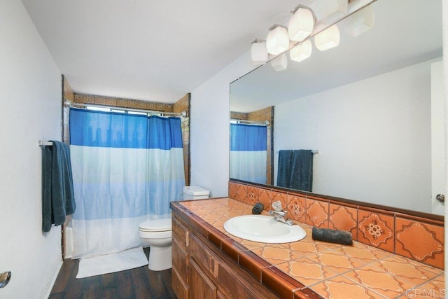 1736 Bellington Ln, Fallbrook, CA 92028 - bathroom featuring vanity, wood finished floors, shower / bath combination with curtain, and decorative backsplash