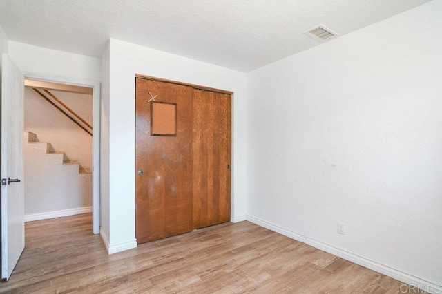 1736 Bellington Ln, Fallbrook, CA 92028 - unfurnished bedroom with light wood-style floors and a closet