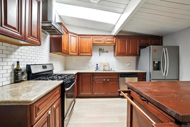 9738 Jamacha Blvd, Spring Valley, CA 91977 - kitchen featuring appliances with stainless steel finishes, wall chimney range hood, light wood finished floors, and backsplash