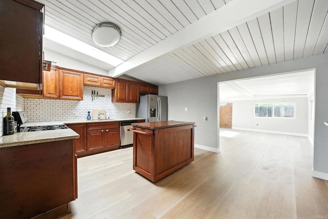 9738 Jamacha Blvd, Spring Valley, CA 91977 - kitchen with stainless steel appliances, backsplash, a kitchen island, light wood-style floors, and wooden ceiling