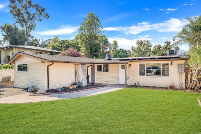 9738 Jamacha Blvd, Spring Valley, CA 91977 - view of front facade with solar panels and a front lawn
