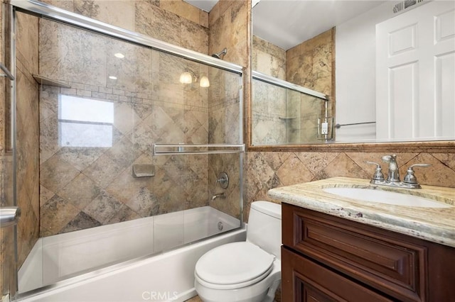 2620 Huntington Ln, Redondo Beach, CA 90278 - bathroom featuring vanity, combined bath / shower with glass door, and tile walls