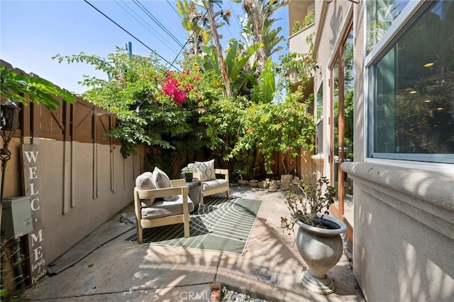 2620 Huntington Ln, Redondo Beach, CA 90278 - fenced backyard featuring a patio and an outdoor hangout area