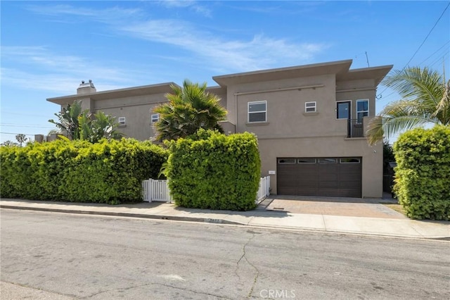 2620 Huntington Ln, Redondo Beach, CA 90278 - view of front of house with stucco siding, driveway, and an attached garage