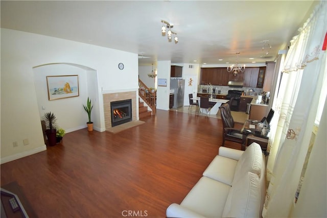 13647 Mesa Linda Ave, Victorville, CA 92392 - living room with a chandelier, dark wood finished floors, a fireplace, and recessed lighting