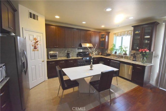 13647 Mesa Linda Ave, Victorville, CA 92392 - kitchen featuring stainless steel appliances, exhaust hood, decorative backsplash, glass insert cabinets, and recessed lighting