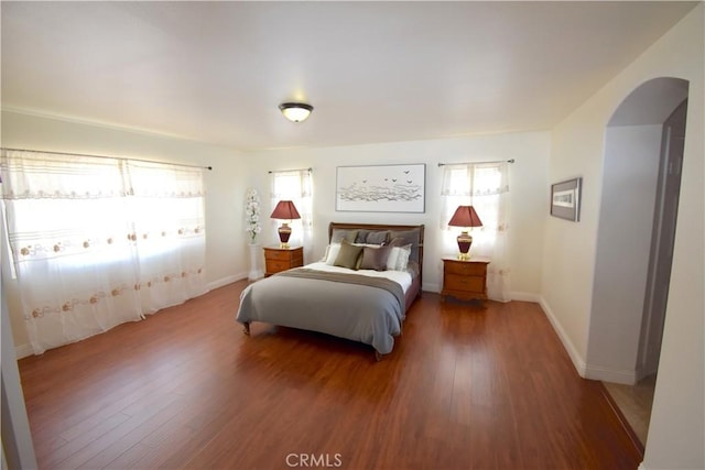 13647 Mesa Linda Ave, Victorville, CA 92392 - bedroom featuring arched walkways and wood finished floors