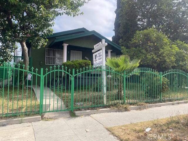 1113 E 83rd St, Los Angeles, CA 90001 - view of front of house with a gate and a garage