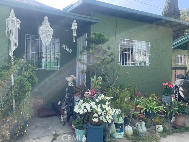 1113 E 83rd St, Los Angeles, CA 90001 - view of property exterior with stucco siding