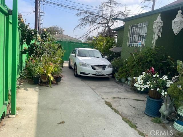 1113 E 83rd St, Los Angeles, CA 90001 - view of car parking featuring driveway