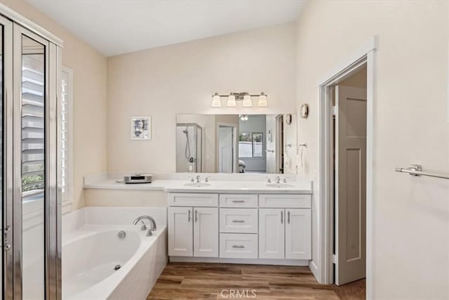 232 Loretta Way, Calimesa, CA 92320 - full bath with double vanity, a garden tub, wood finished floors, and a shower