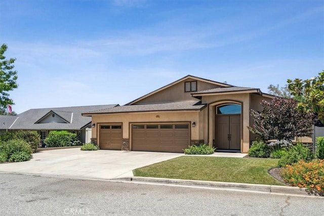 232 Loretta Way, Calimesa, CA 92320 - view of front of property featuring a garage, stucco siding, driveway, and a front yard