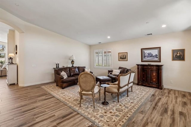 232 Loretta Way, Calimesa, CA 92320 - living area with arched walkways, wood finished floors, and recessed lighting