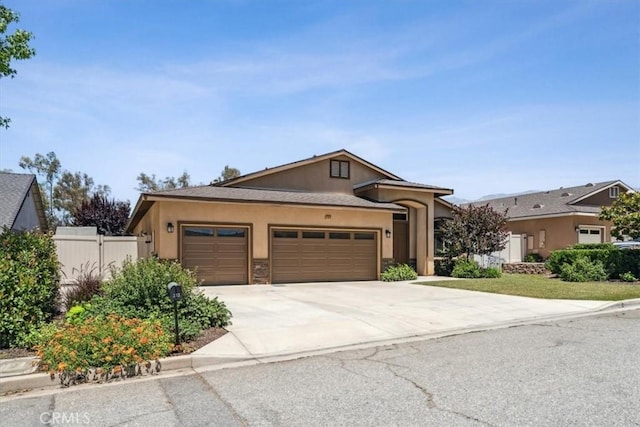 232 Loretta Way, Calimesa, CA 92320 - ranch-style house featuring stucco siding, an attached garage, and driveway
