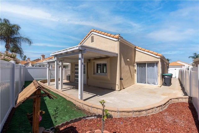 28076 Orangegrove Ave, Menifee, CA 92584 - rear view of house featuring stucco siding, a tile roof, a patio area, and a fenced backyard