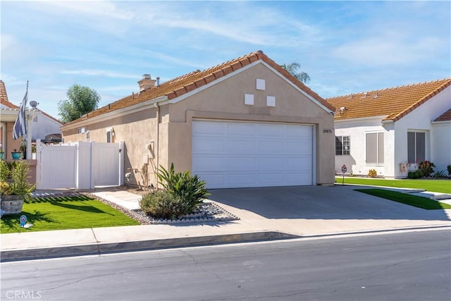 28076 Orangegrove Ave, Menifee, CA 92584 - view of front facade with stucco siding, concrete driveway, an attached garage, and a chimney
