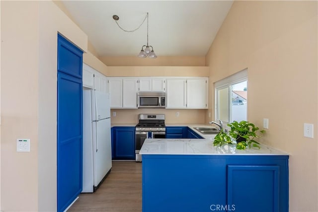 28076 Orangegrove Ave, Menifee, CA 92584 - kitchen with appliances with stainless steel finishes, a peninsula, white cabinets, blue cabinets, and light wood-type flooring