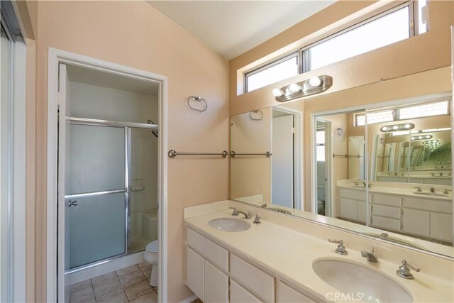 28076 Orangegrove Ave, Menifee, CA 92584 - bathroom featuring double vanity, a shower stall, and tile patterned flooring