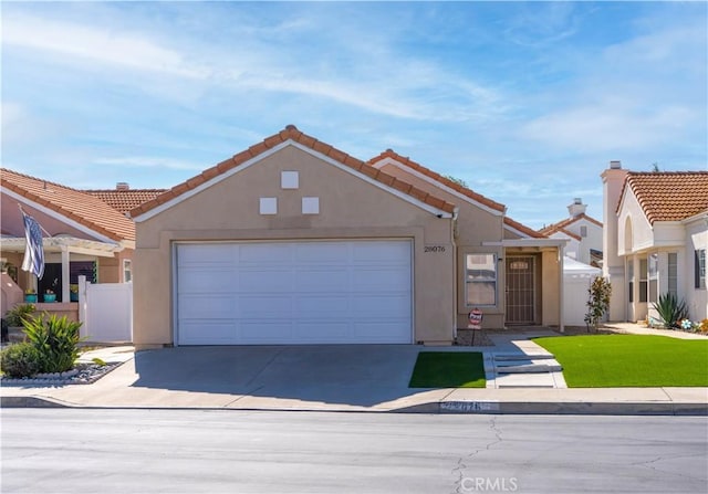 28076 Orangegrove Ave, Menifee, CA 92584 - view of front of house with driveway, stucco siding, a garage, and a tile roof