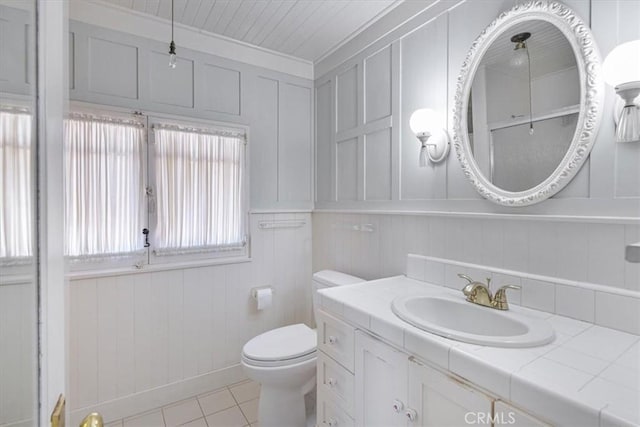 625 High Dr, Laguna Beach, CA 92651 - bathroom featuring vanity, tile patterned flooring, and a decorative wall