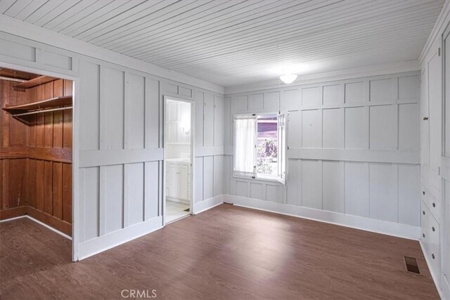 625 High Dr, Laguna Beach, CA 92651 - spare room with wood finished floors and a decorative wall