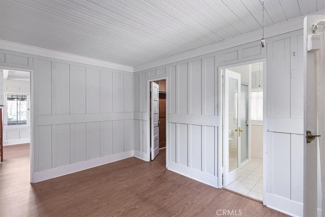 625 High Dr, Laguna Beach, CA 92651 - spare room with ornamental molding, a decorative wall, and dark wood-style floors