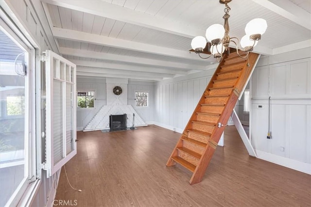 625 High Dr, Laguna Beach, CA 92651 - stairs featuring a chandelier, wood finished floors, a wood ceiling with exposed beams, and a decorative wall