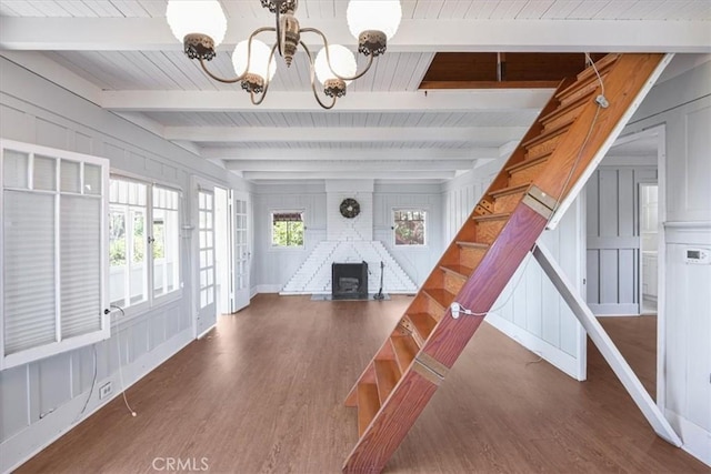 625 High Dr, Laguna Beach, CA 92651 - foyer featuring a chandelier, wood finished floors, a wooden ceiling with exposed beams, a decorative wall, and stairs